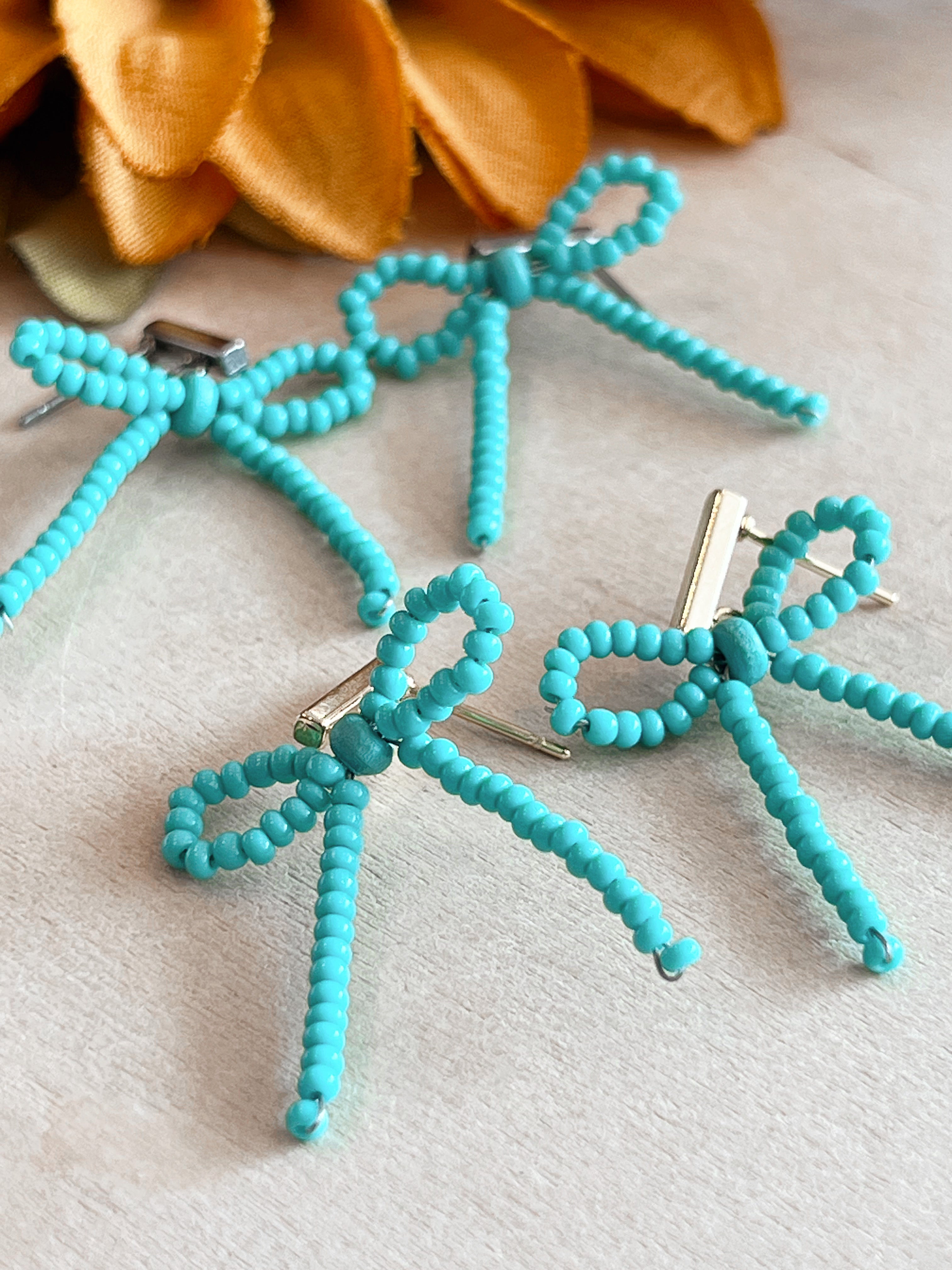 Turquoise Bow Handbeaded Earrings